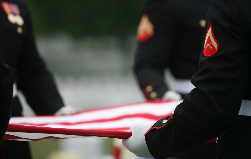 U.S. Marine Corps Honor Guard conducting flag folding ceremony. U.S. Marine Corps Honor Guard conducting flag folding ceremony.