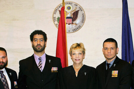 Centered above: New York Supreme Court Justice Honorable Judge Hirsch, presiding over the Queens County Veterans Treatment Courts.