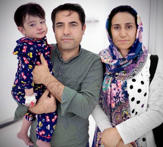 Seen above is the child patient with his parents, pre-surgery.