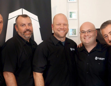 Centered: Bill Vallely with members of the Collision Training Institute