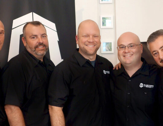 Centered: Bill Vallely with members of the Collision Training Institute