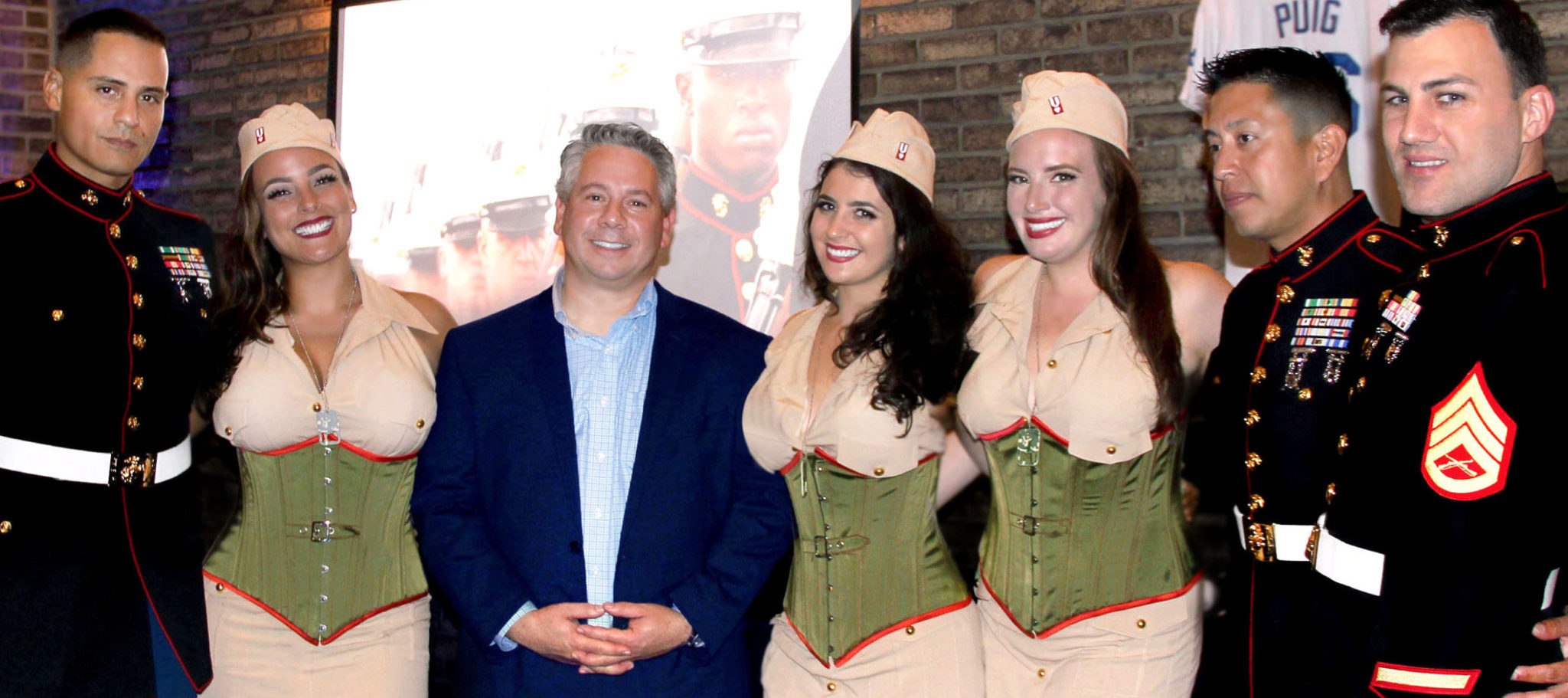 Seen centered is VRL supporter: Jim Nekos, of Edge Technologies, accompanied by the VRL Vixens, and the US Marines.