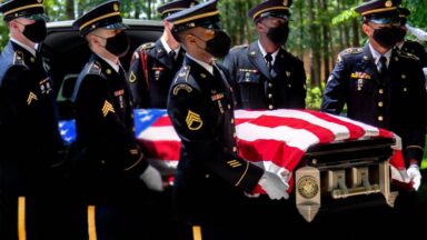 Military honor guard during memorial service for the fallen.