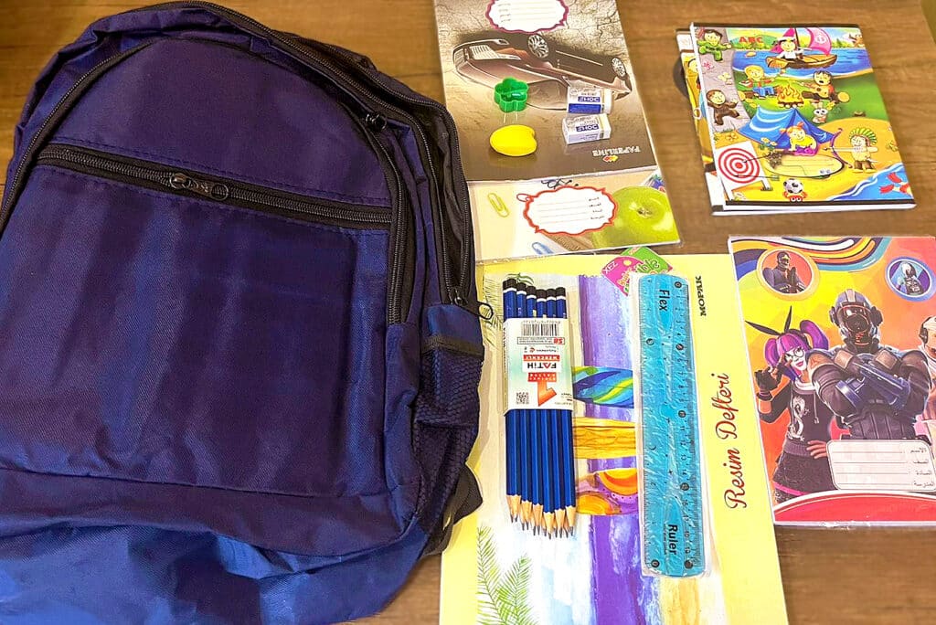 School supplies including backpacks and stationary donated to displaced children through the 2023 humanitarian initiative.