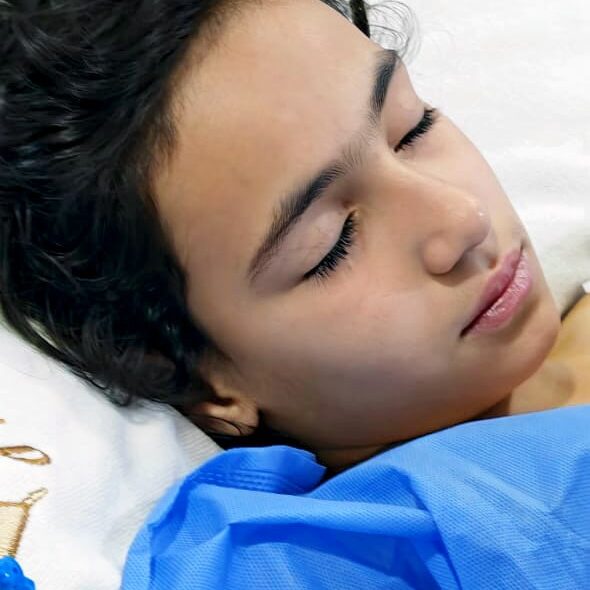 Veterans Rebuilding Life: childe medical missions. Child patient resting, post surgery.