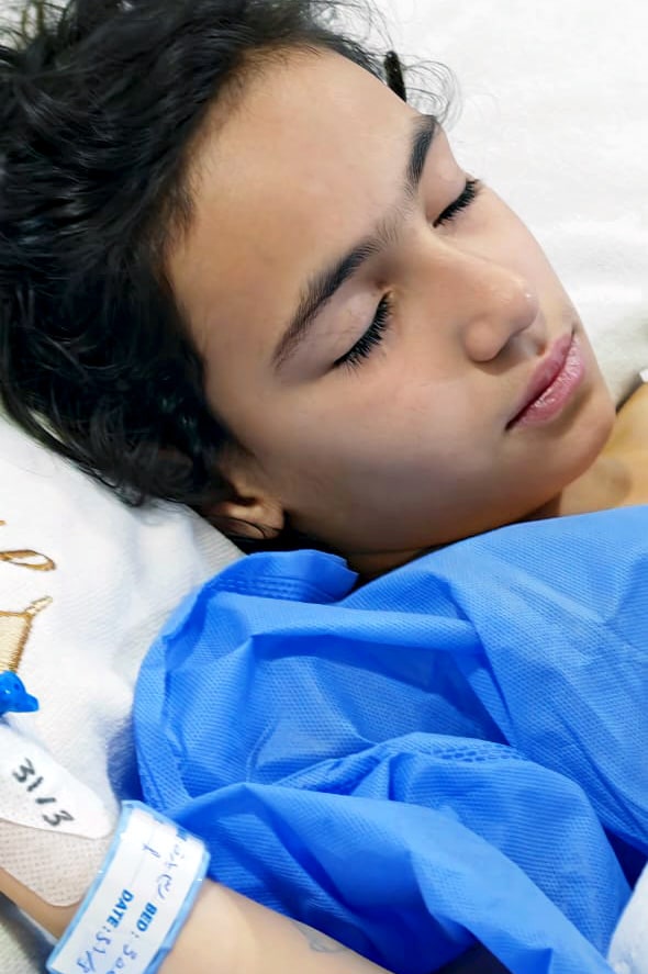 Child patient resting, post surgery.