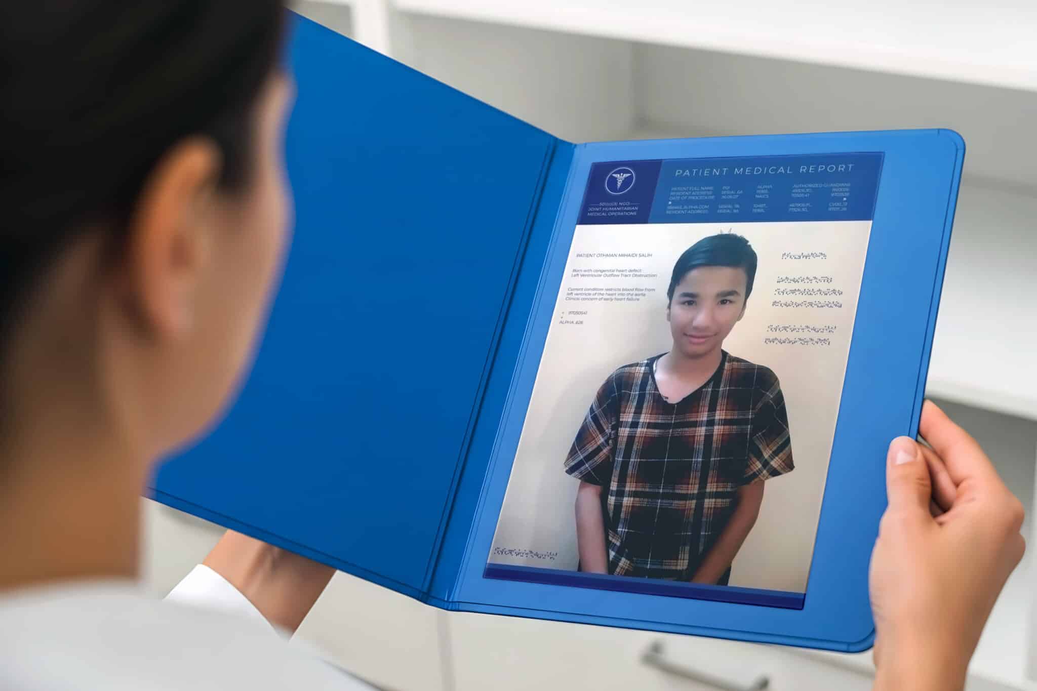 Doctors review Othman's medical report, prior to the child patient's open heart surgery.