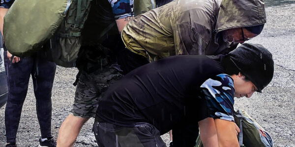 Veterans gear-up in the rain at the start of the hike on Wildcat Mountain.