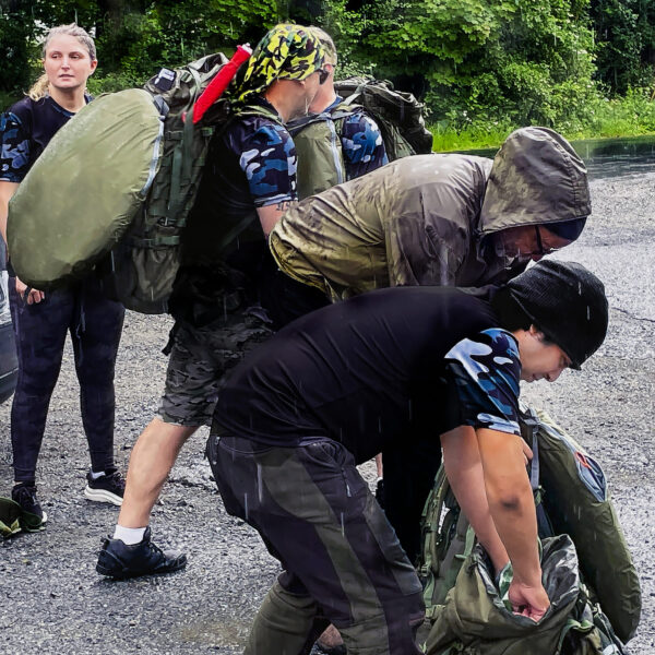 Veterans gear-up in the rain at the start of the hike on Wildcat Mountain.