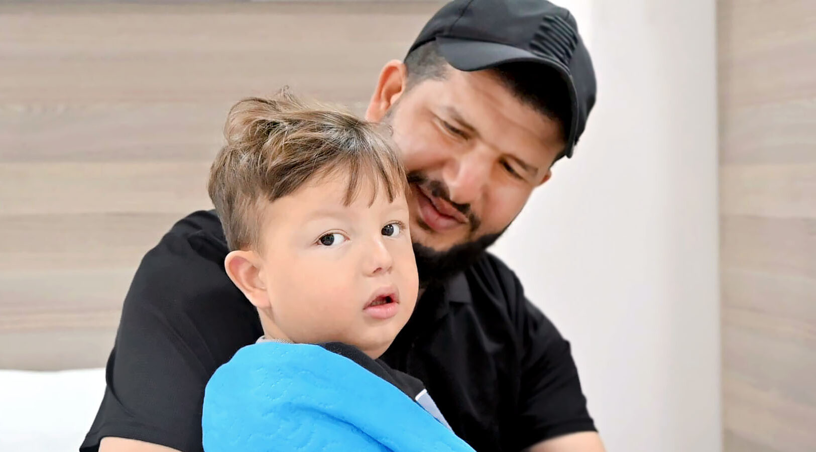 Child patient Ayham with his father, post surgery. Child patient Ayham with his father, post surgery.